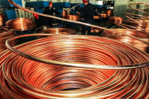 Chinese workers monitor production of coiled copper tubes at a copper product plant in Nantong city, east China's Jiangsu province, 7 January 2015.

Economists say the world economy will do better this year. The copper market is saying that wont be enough to eliminate a supply glut that's lasted at least two years. Prices of the metal slumped to the lowest since October 2009 today, fueled by concerns that production is outpacing demand. China's copper consumption will grow at the slowest pace since at least 2010, Deutsche Bank AG predicts. At the same time, global economic growth will be the best in four years, economist estimates compiled by Bloomberg show. Copper's plunge mirrors losses across commodities as a decade-long bull market led companies to boost production and the Federal Reserve debates when to raise interest rates. Investors last week doubled bets on more losses in copper, already the worst-performing industrial metal in the past year after plunging 17 percent.
